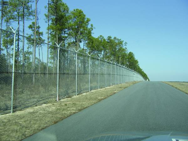 The chain link fence is installed on the roadside.