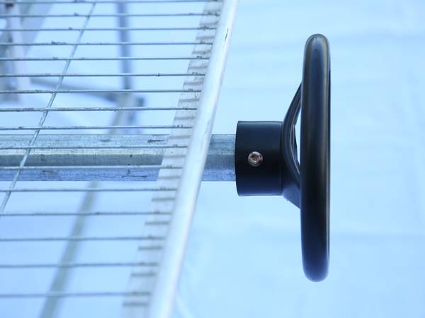 A close up picture of the steering wheel of greenhouse rolling bench.